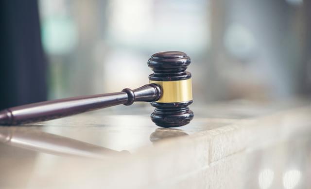 gavel isolated on wooden table